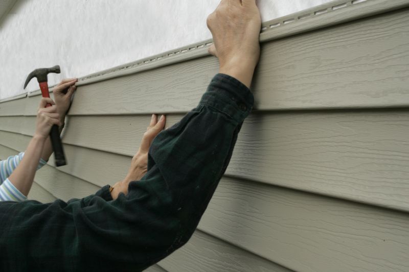 Reattached Vinyl Siding
